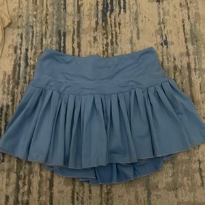 light blue pleated gold hinge skirt